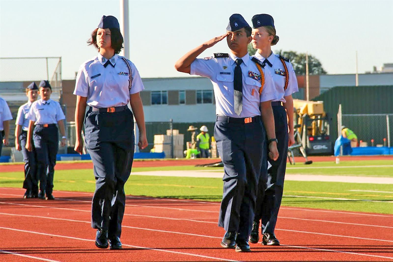 The Cypress Creek High School Air Force JROTC unit cadet executive staff march in front of Pass in Review guests.